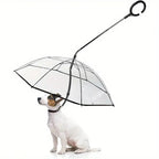 A small white dog sitting under a clear transparent dog umbrella with an attached leash on a white background.