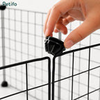 Close-up hand assembling a corner connector on a Petifo black wire pet playpen.
