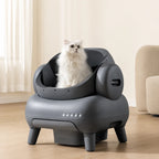 Fluffy white cat sitting comfortably inside a grey modern Neakasa self-cleaning litter box.