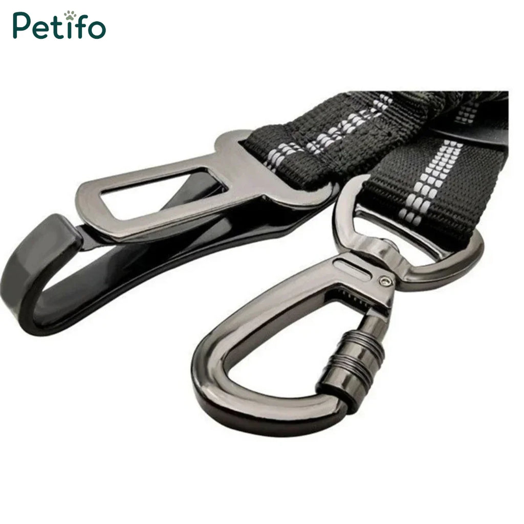 Detailed view of the heavy-duty metal seat belt buckle and swivel locking carabiner.