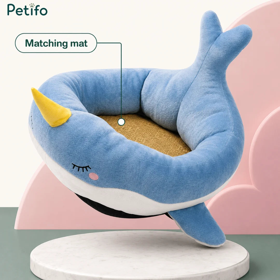 Petifo blue narwhal plush cat bed featuring a matching removable interior mat.