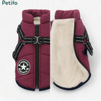 Wine red winter dog coat displaying the outer shell zipper and soft inner fleece lining.