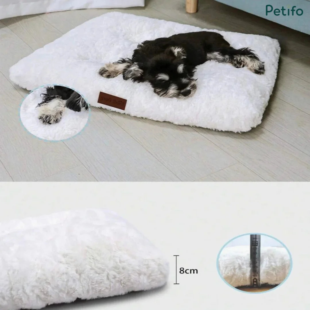 Miniature schnauzer resting on a plush white pet mat highlighting its thick 8cm profile and soft texture.