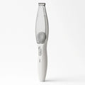 White pet hair trimmer with a built-in transparent vacuum chamber standing vertically against a white background.