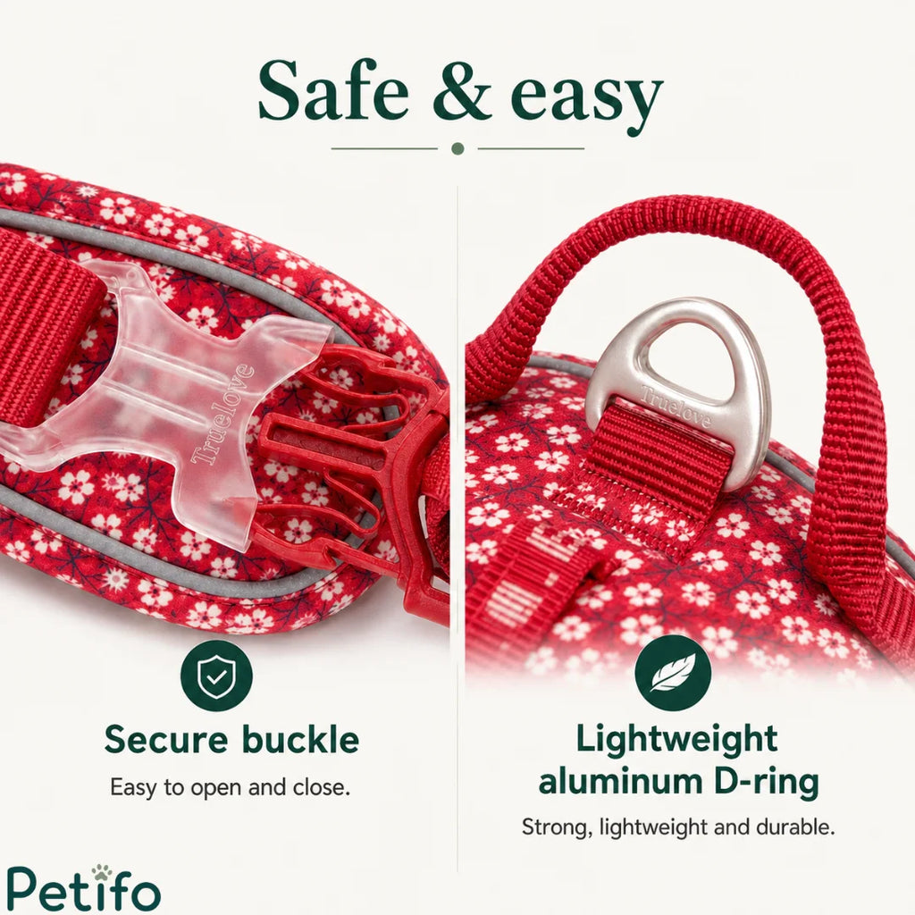 Close-up view of the secure plastic release buckle and durable aluminum D-ring on the vibrant red floral pet vest.