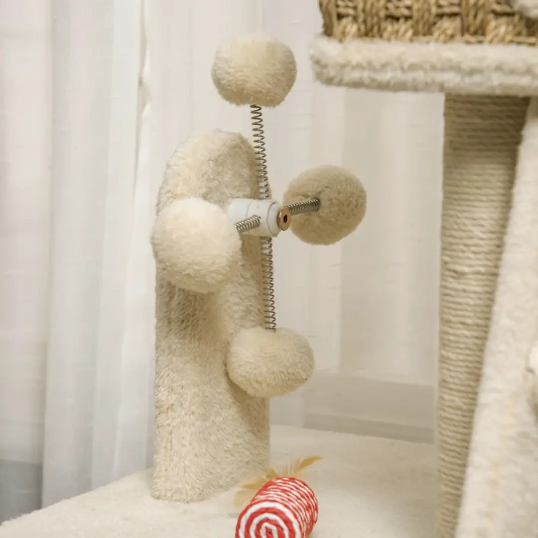 Spring-mounted pom-pom toy on the PawHut cat tree - Petifo