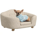 PawHut elevated pet sofa bed with a small dog - Petifo